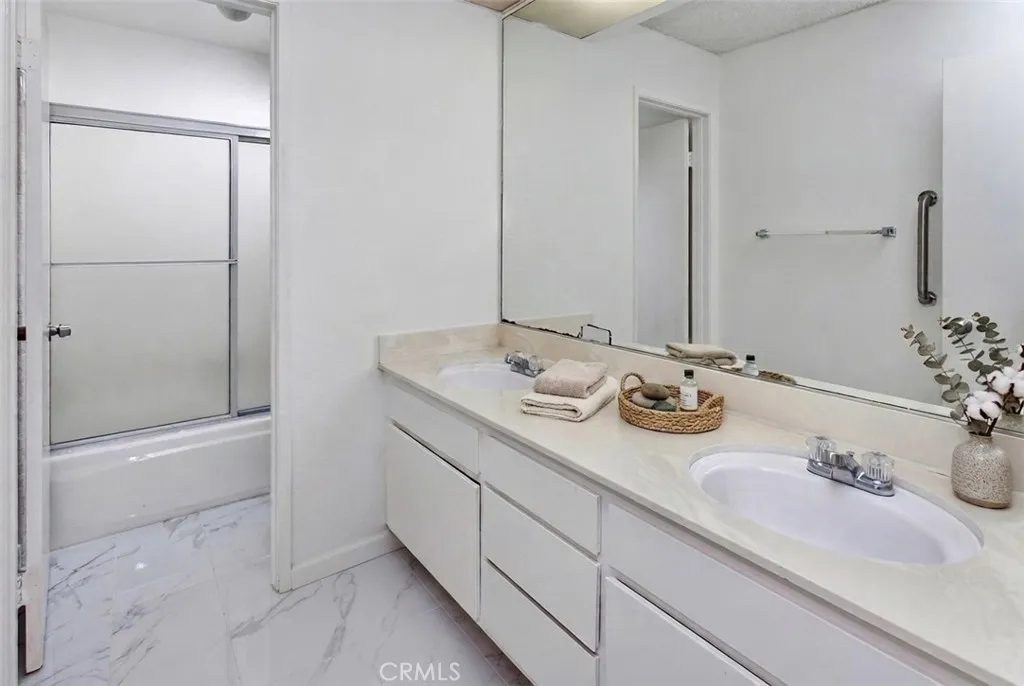 Photo is virtually staged.  Property shows as in previous photo. Remodeled guest bath.