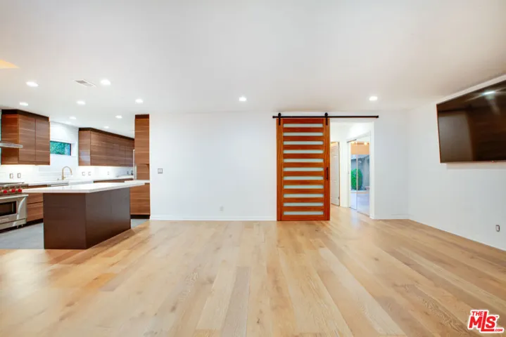 open concept living w 85" TV