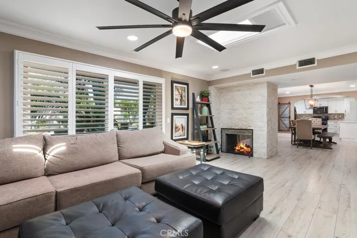 living room with 2 sided gas fireplace