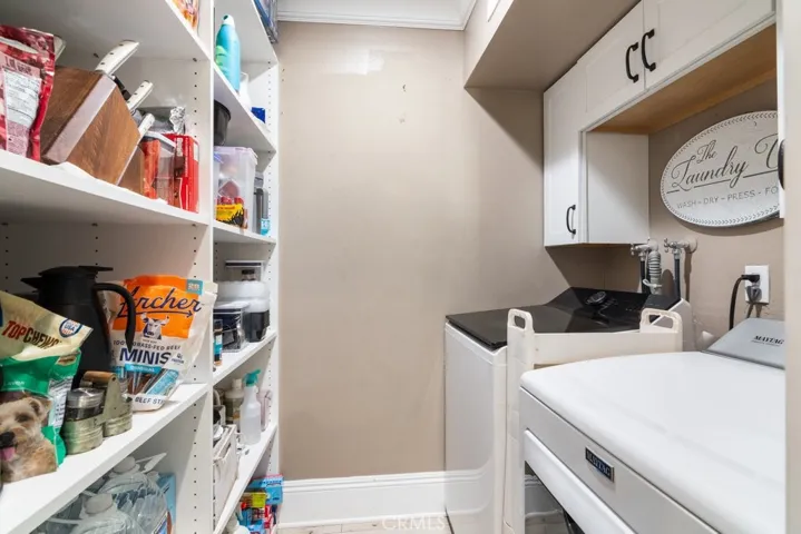 laundry with with wall to wall pantry