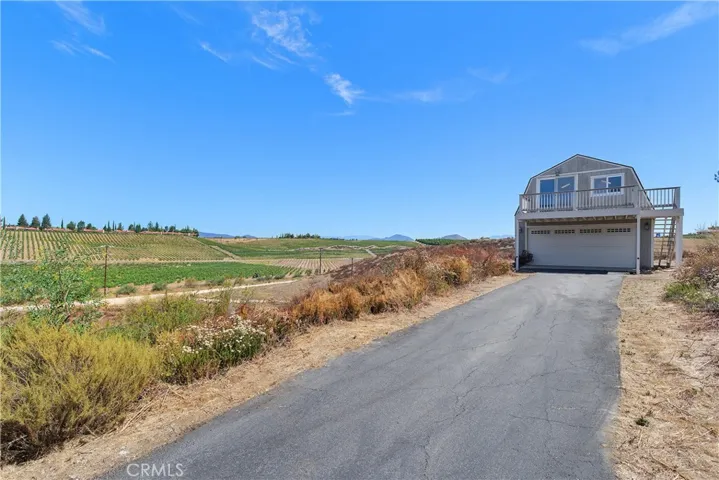 Permitted Barn/Workshop or Secondary 2 car Garage with a loft used as game room & office area. Double sklylights and decking with views.