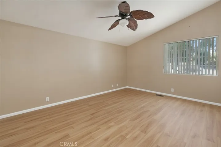 Bedrooom 2 virtually staged with flooring and paint.