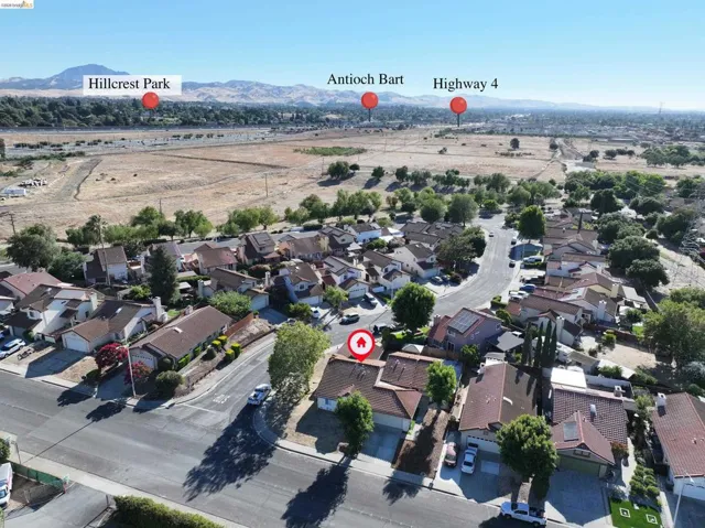 Residential neighborhood setting with tree-lined streets and varied architectural styles