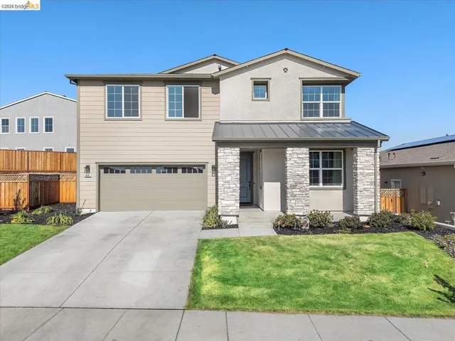 Contemporary two-story exterior featuring a stone and stucco facade
