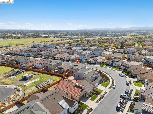 Aerial depiction of a residential neighborhood featuring single-family homes with varying architectural styles