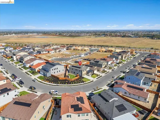 Aerial perspective of a contemporary residential neighborhood featuring diverse architectural styles and varied rooflines