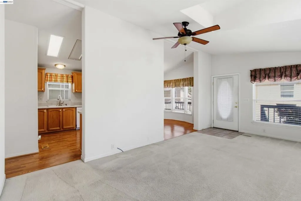 Vaulted ceilings and fan in Living Room