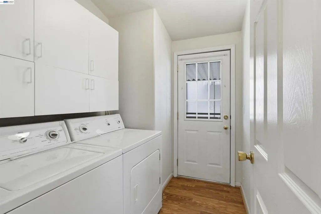 Washer, Dryer, Storage and side access to carport.