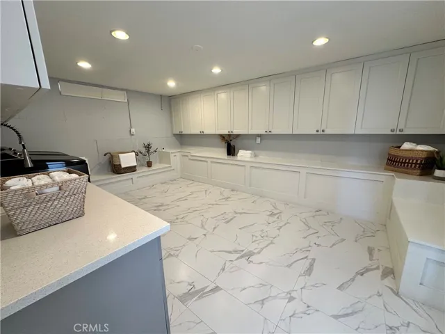 Huge laundry room with plenty of storage space