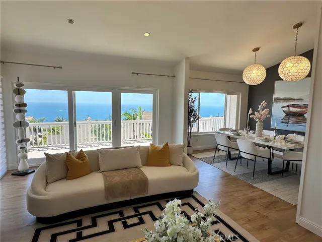 Panoramic ocean view through living rm and dining rm