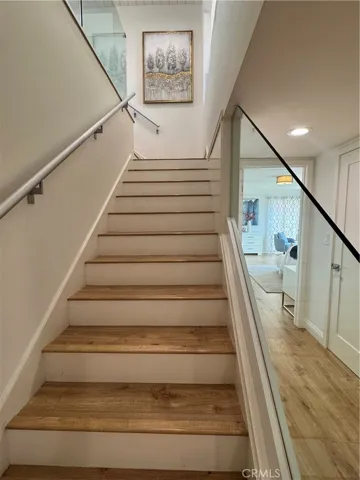 staircase with glass railings