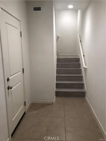 Garage entrance and stairs to the second floor.