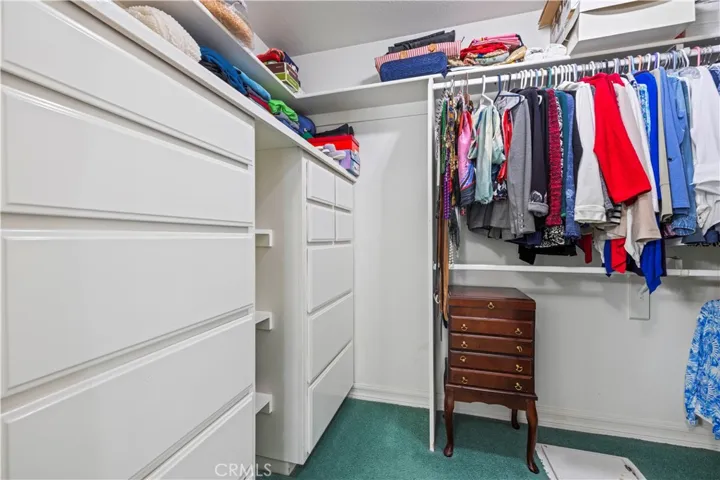 primary bedroom walk-in closet & floor laundry chute