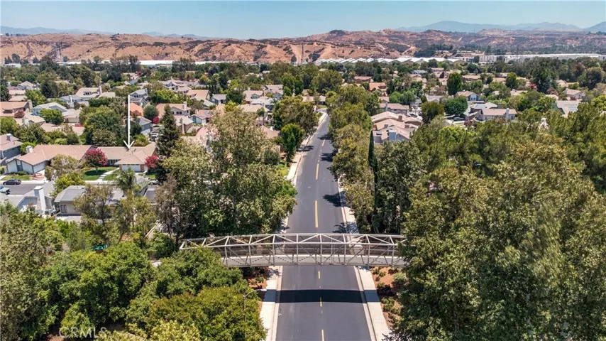 Arial view of neighborhood and cross bridge.
