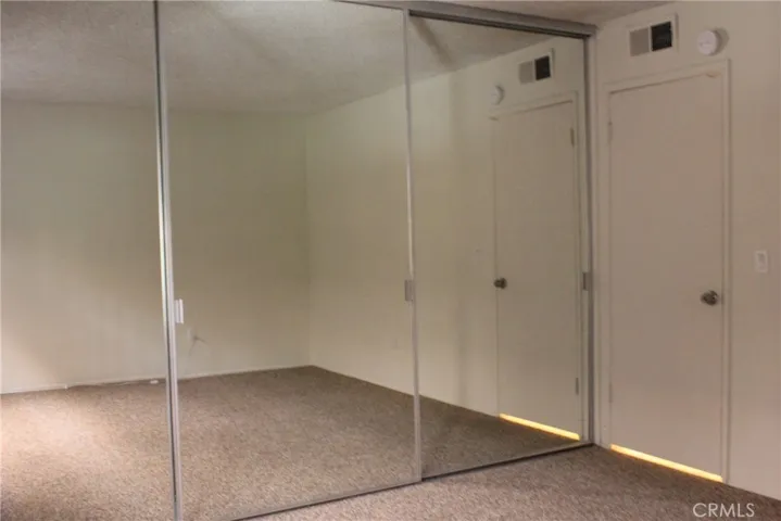 Wall of mirrored closet doors