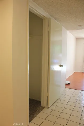Hallway with storage closet