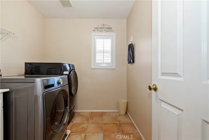 Conveniently located second floor laundry room with Utility sink.