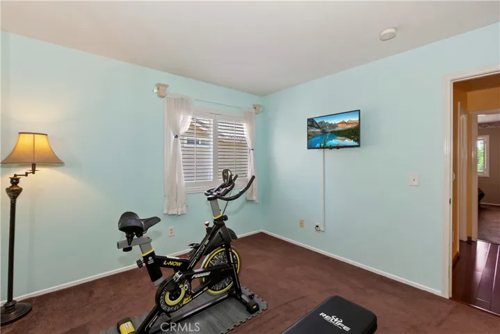 4th bedroom is being utilized as an exercise room.