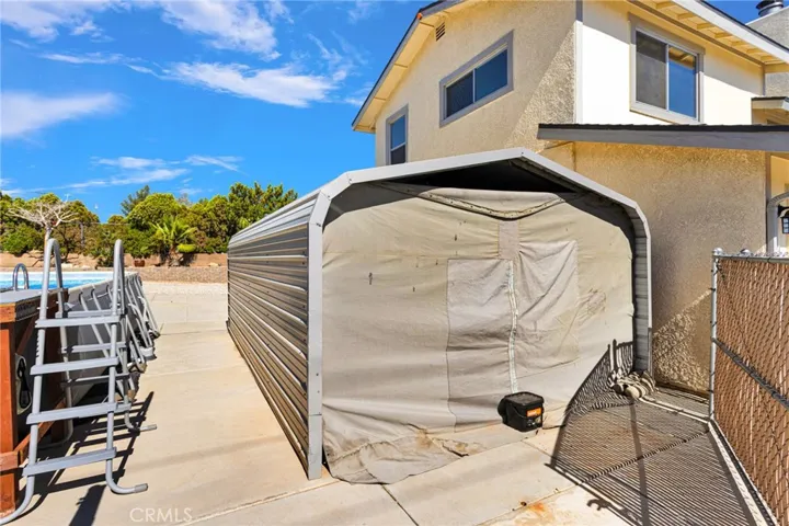side of house. Another storage/covered parking port.