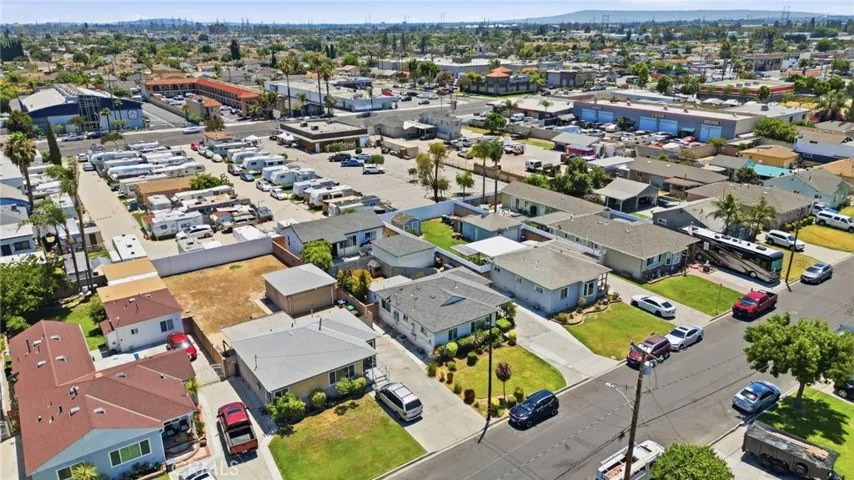 Subject property is in center with black car in front