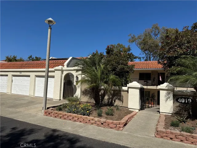 Casa Milano with epic views of the entire valley over the Aliso Viejo Country Club Golf Course, garage and driveway