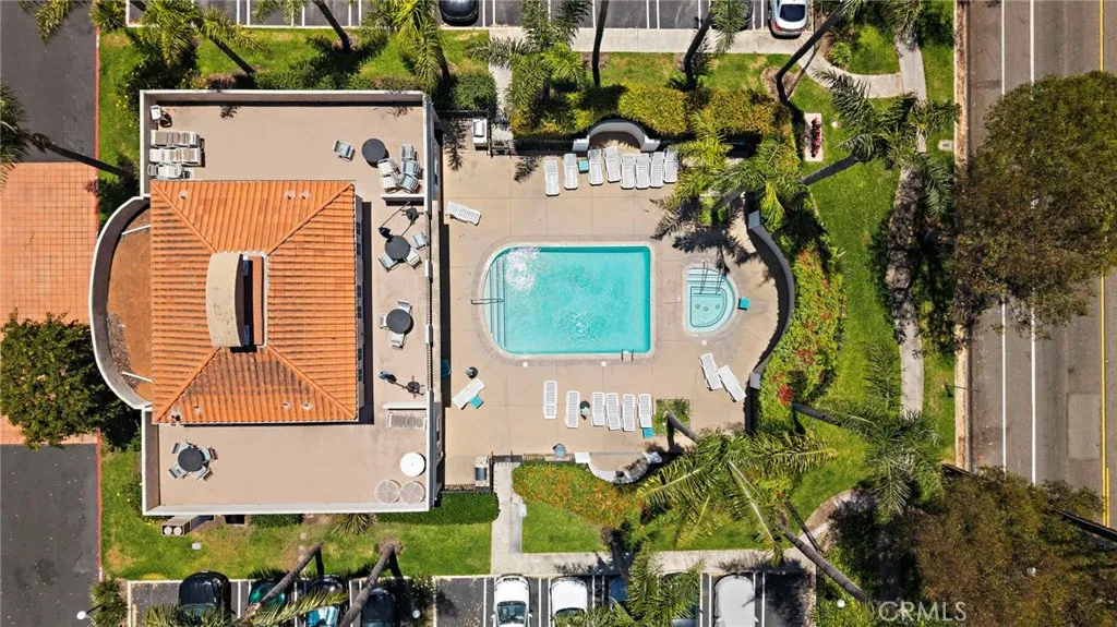 Enjoy resort-style amenities including a sparkling pool and spa, fitness center, clubhouse, and outdoor barbecue area.