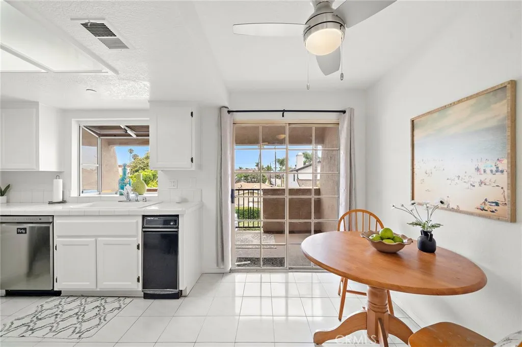 Dining area and well-appointed kitchen creates an inviting gathering space.