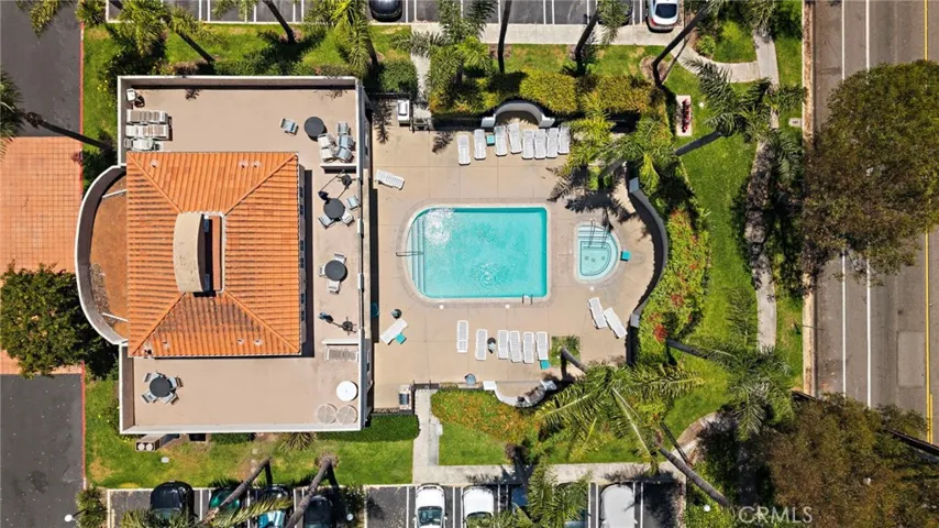 Enjoy resort-style amenities including a sparkling pool and spa, fitness center, clubhouse, and outdoor barbecue area.