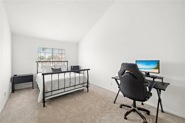 Generously sized primary suites, each enhanced by dramatic vaulted ceilings.