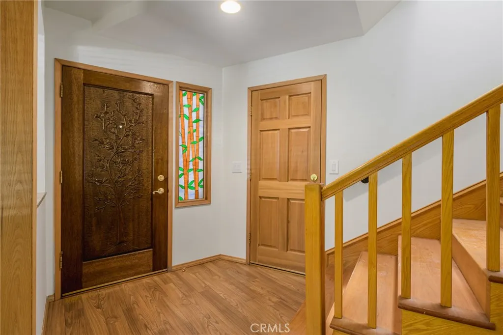 beautifully wood-carved front door with stained glass