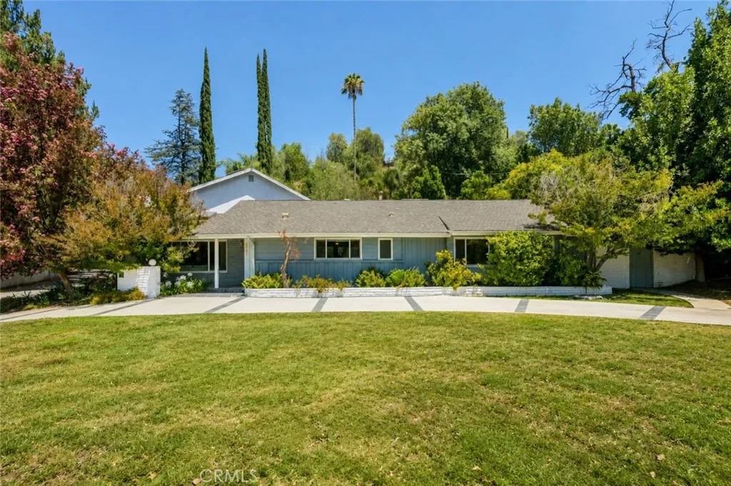 Vanalden St. side of home with circular driveway. Please note, grass has been digitally enhanced.