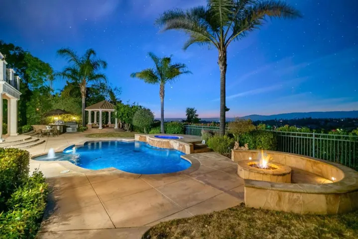 An Entertainer's Delight! Fire-pit, Pool, Outdoor Kitchen, Gazebo and more!