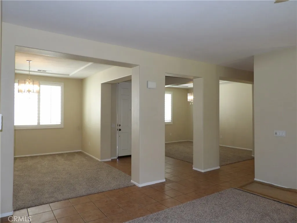 Looking from the family room, towards the living and formal dining areas.