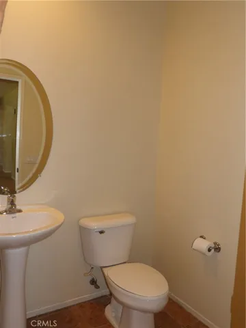 Guest bathroom on opposite side of home, down from living/family rooms.