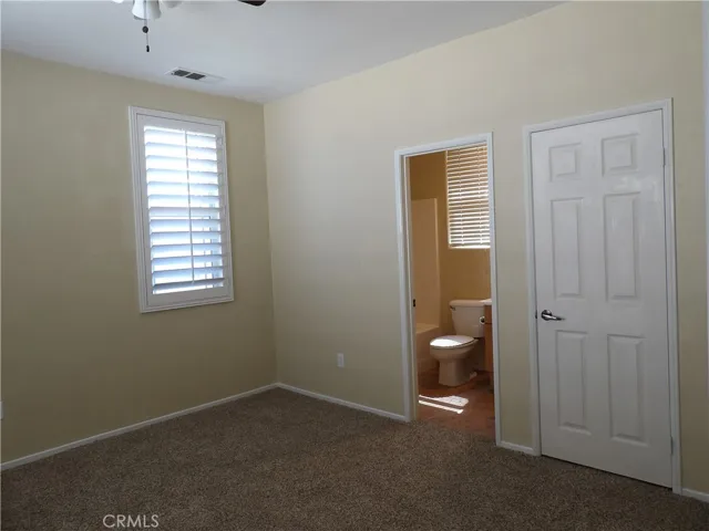 Bedroom #4, with its own full bathroom and walk-in closet. This one faces the front/street.