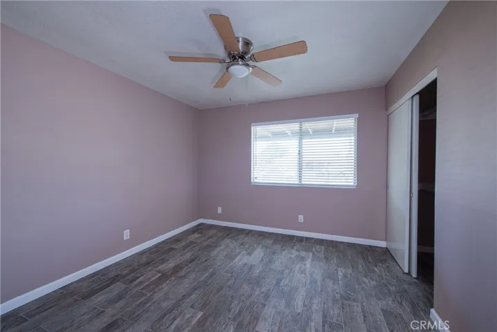 Roomy bedroom 3 is in the front of the home and has a ceiling fan to keep you cool on the warm days and a large window to let the natural light flow throughout the room.