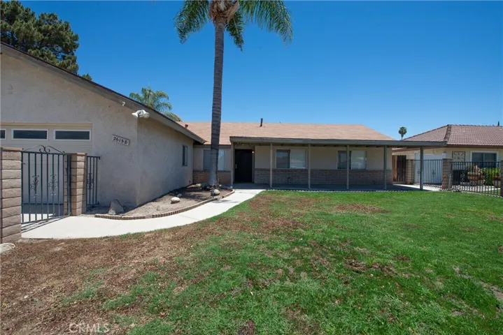 Enter through the gated large front yard.