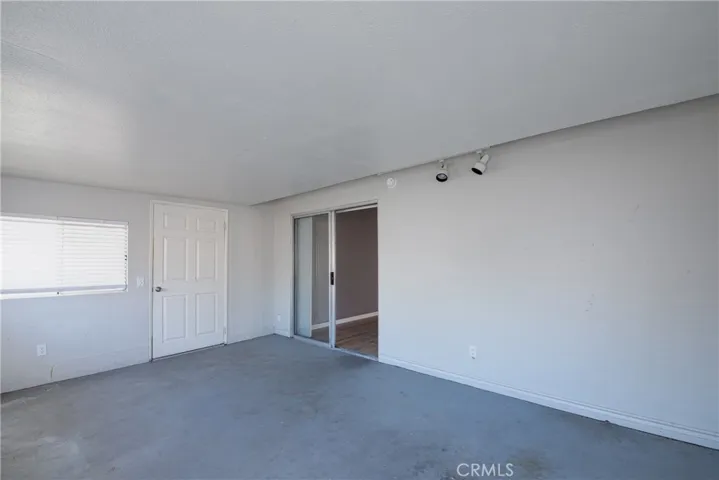 You can access the backyard patio through the sunroom.