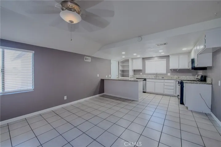 The roomy dining room and kitchen are in the front of the home.