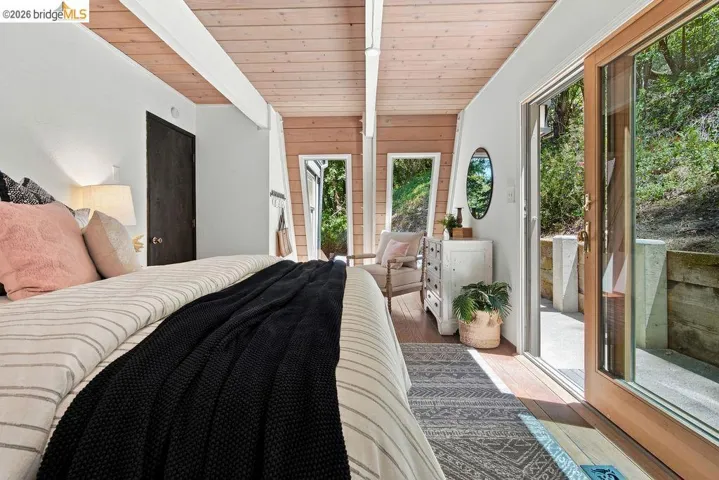 Vaulted wood-paneled ceiling with exposed beams