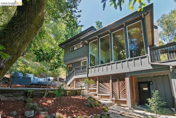 Contemporary exterior with multiple large windows and a sloped roofline