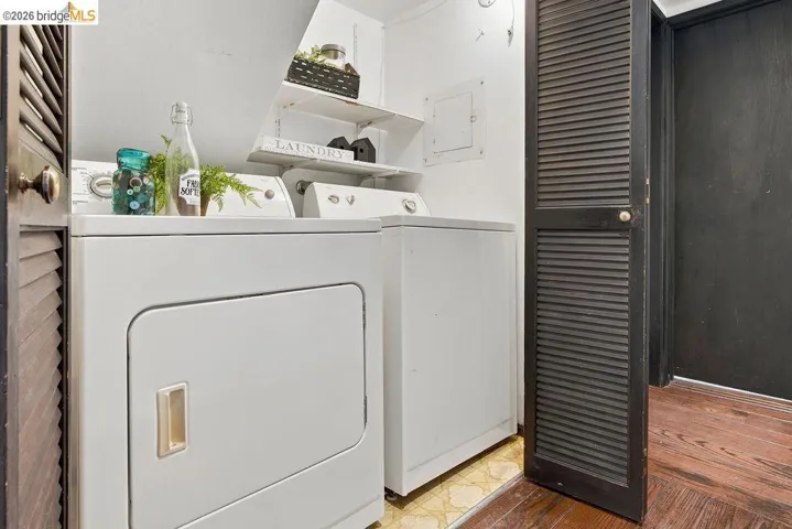 Dedicated laundry area featuring a white dryer and washing machine