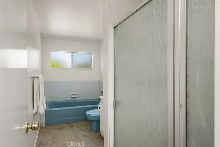 main bathroom. walk in shower and separate bath tub.