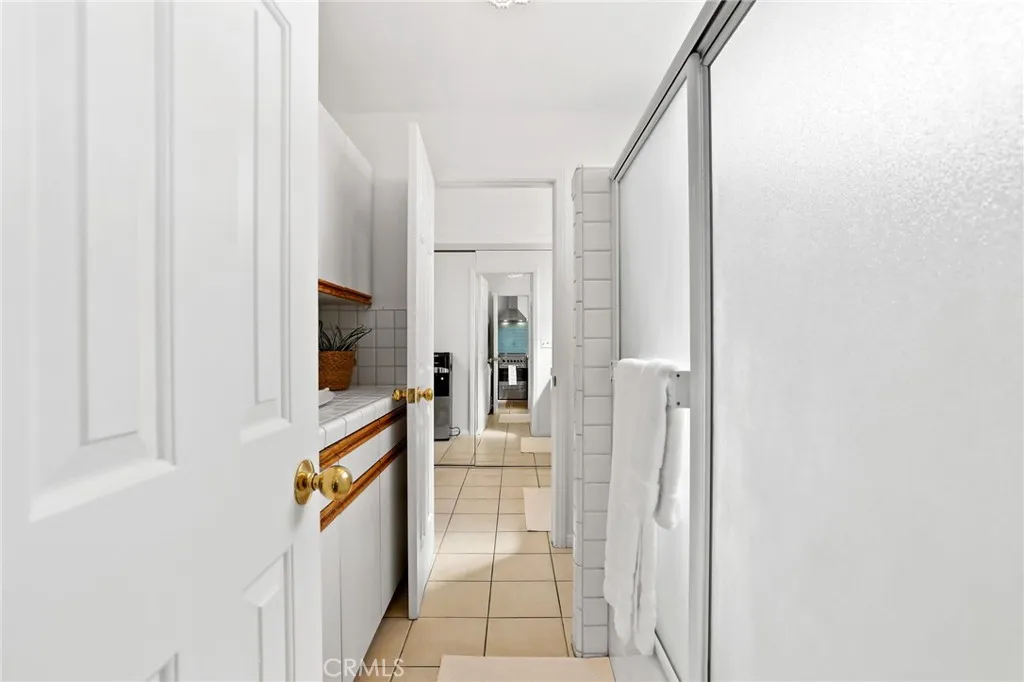 Entrance to laundry and bathroom area in guest suite