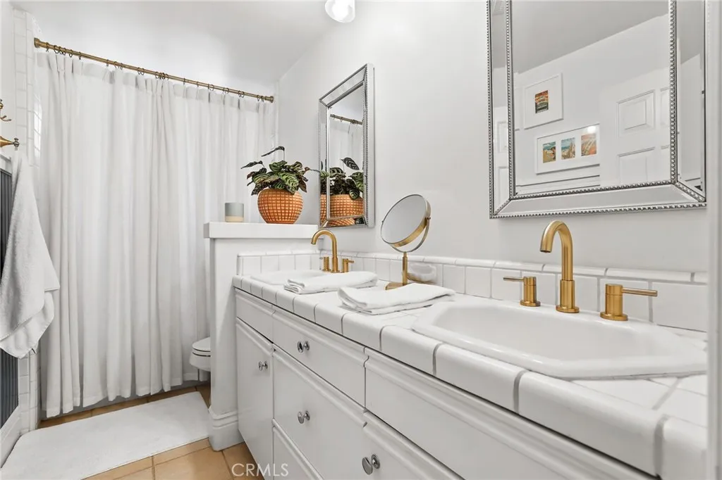 Front primary suite bath with double sinks