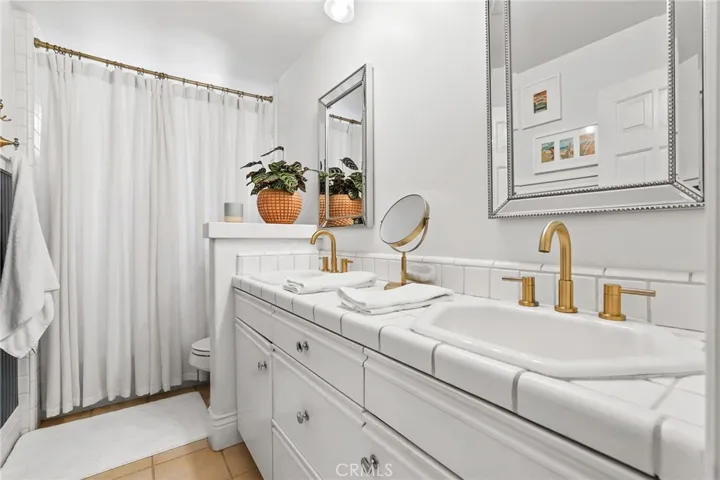 Front primary suite bath with double sinks
