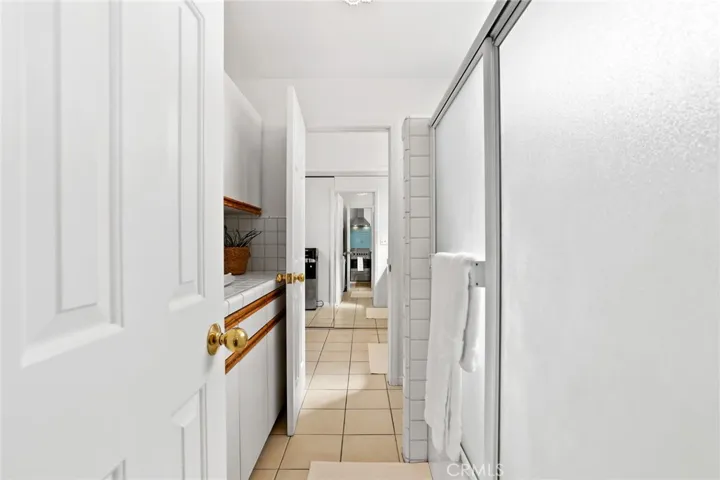 Entrance to laundry and bathroom area in guest suite