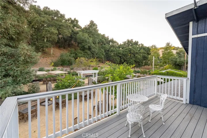 Upstairs deck overlooking back patio and event area.