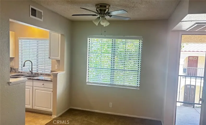 Living room window and kitchen/front door screen