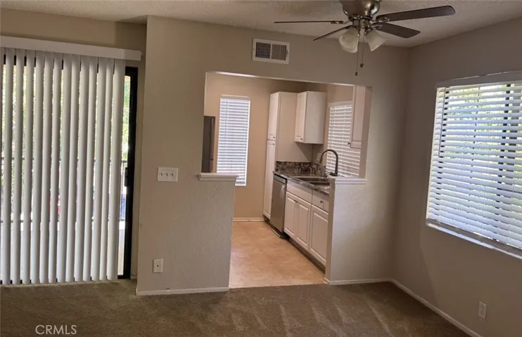 View of kitchen and balcony sliding door